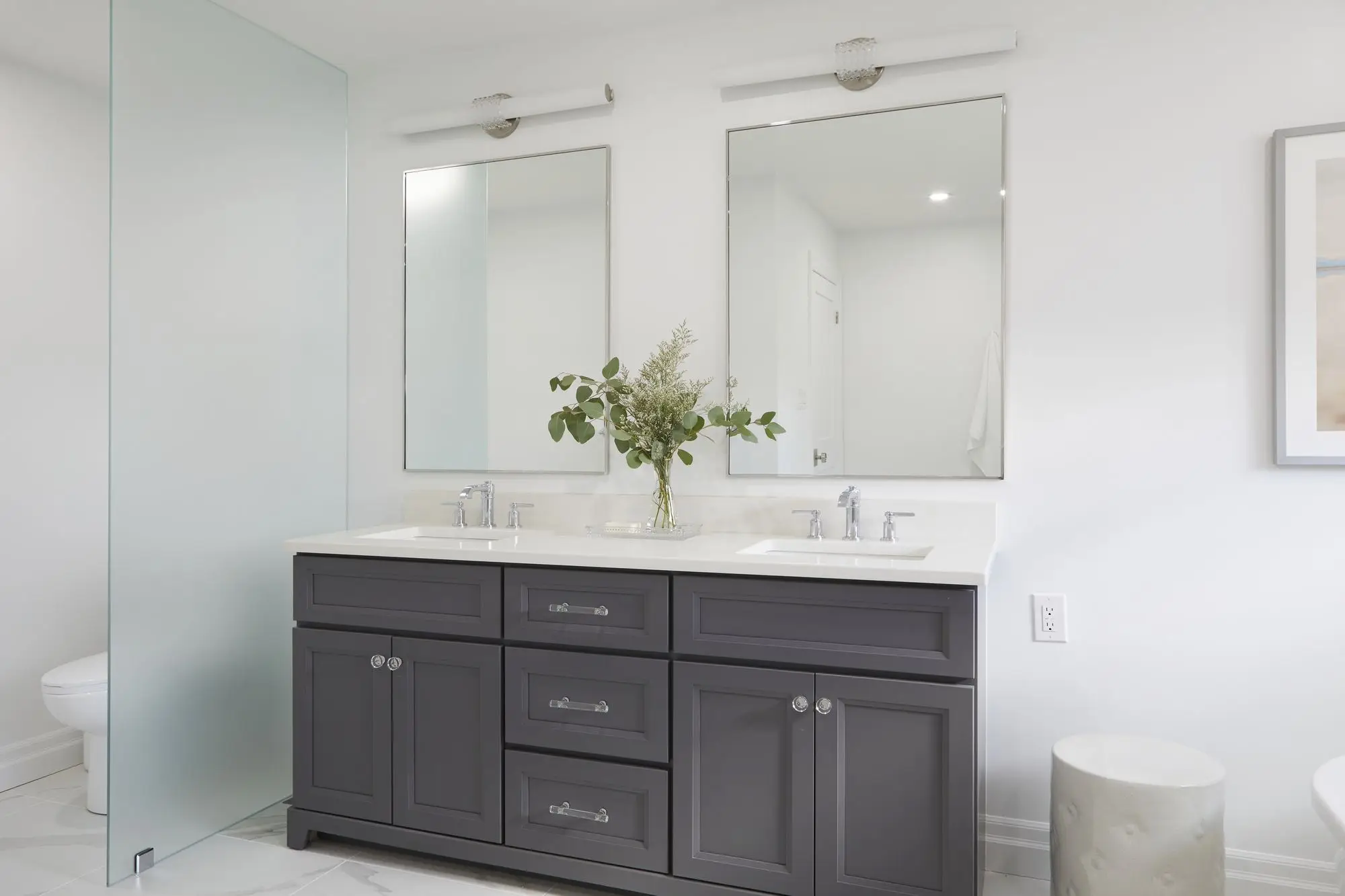 Modern bathroom renovation in Toronto with double vanity and bright clean finishes.