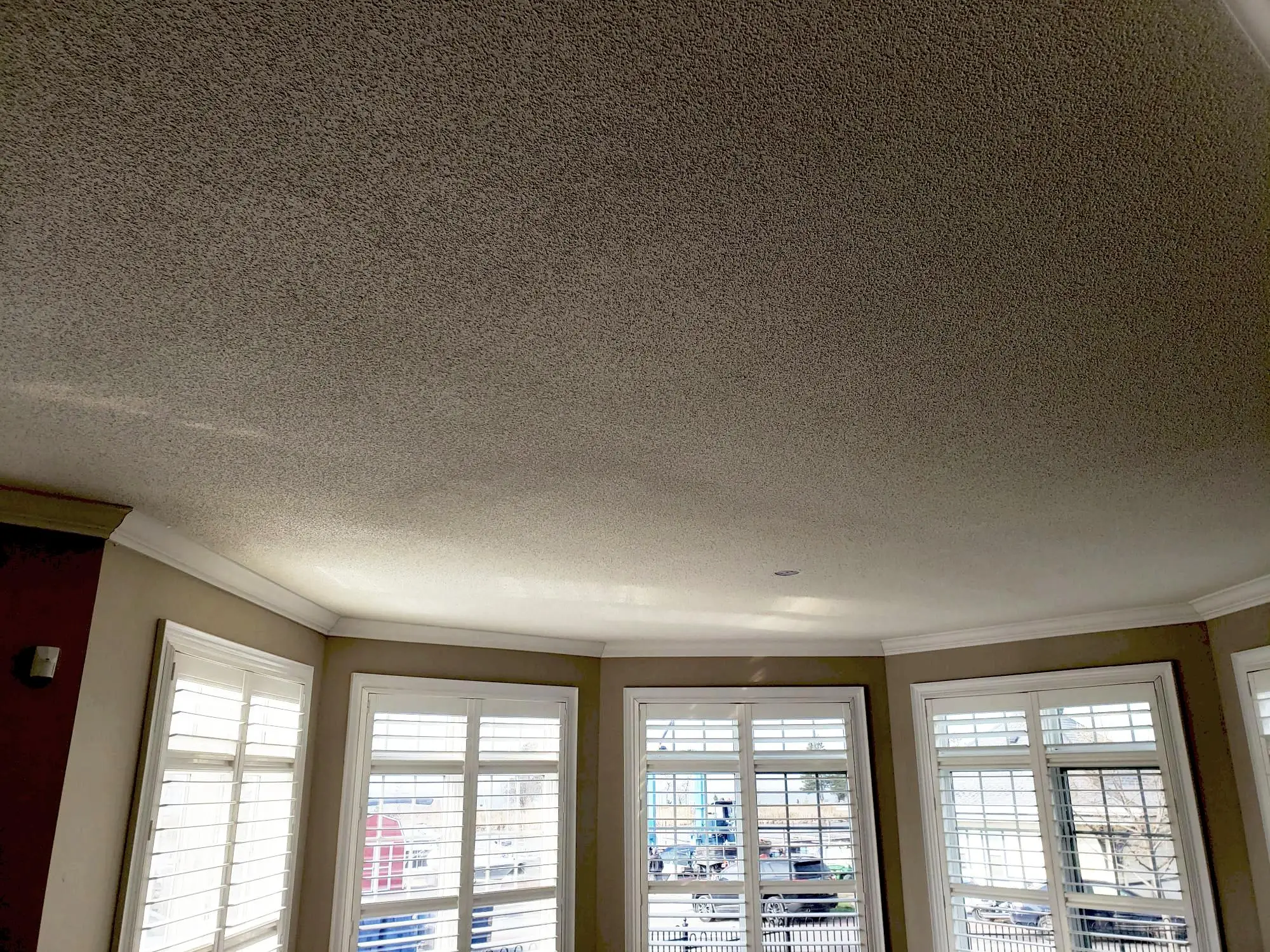 Pre-removal ceiling inspection and full room preparation before popcorn ceiling removal in a GTA home.