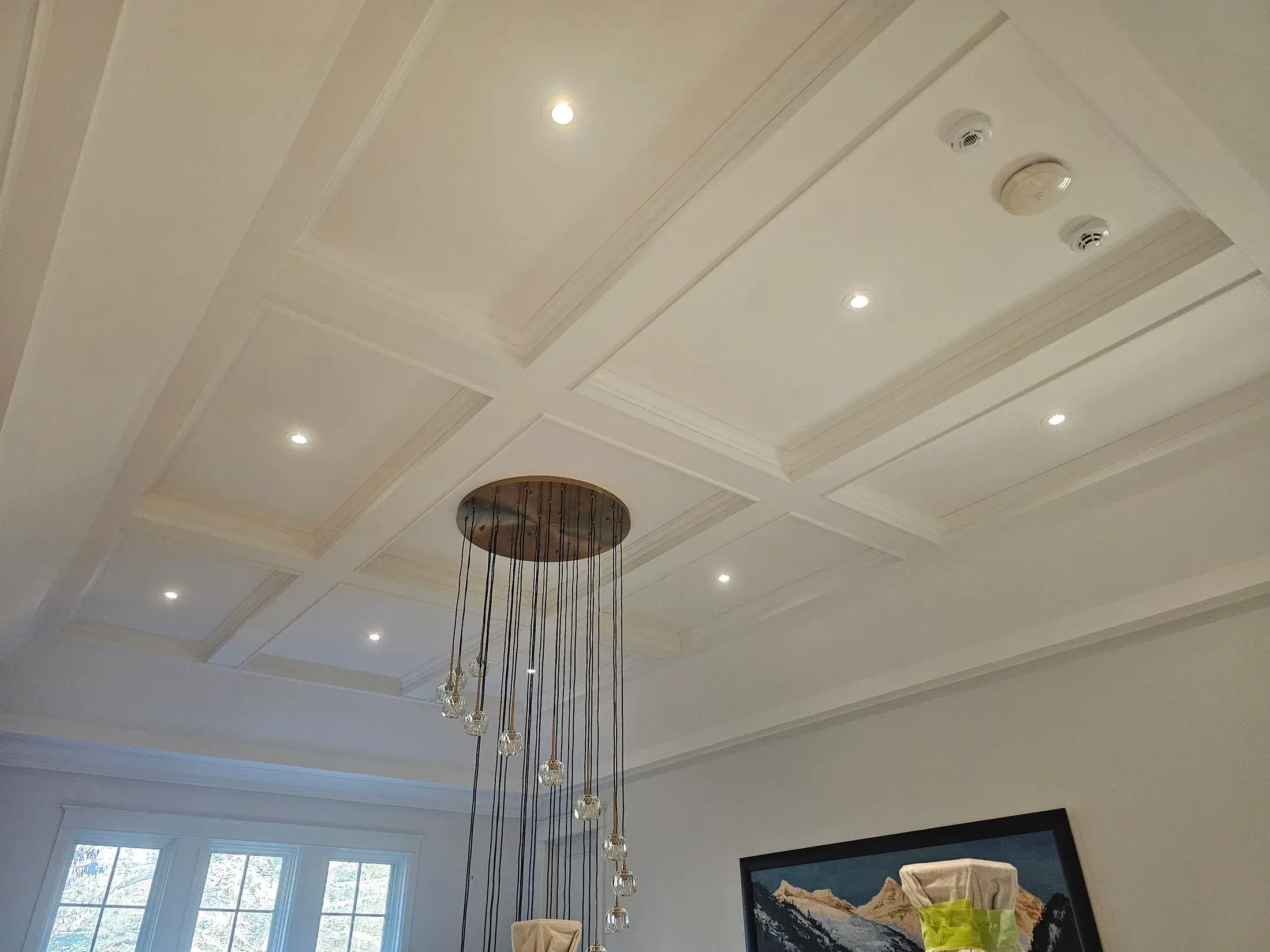 Popcorn ceiling removal followed by smooth ceiling finishing.
