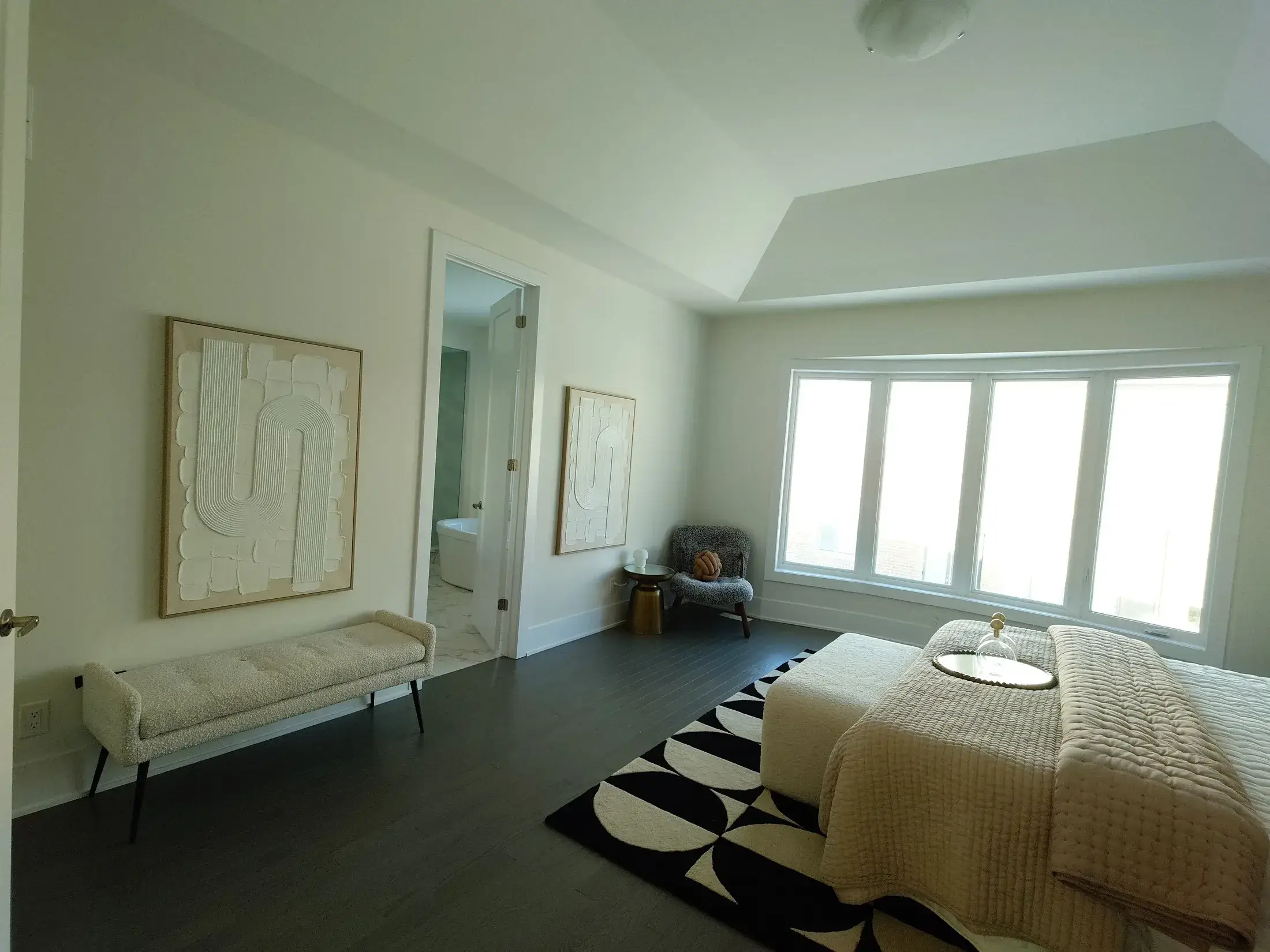 Bedroom interior painting with bright white walls and clean finished trim.
