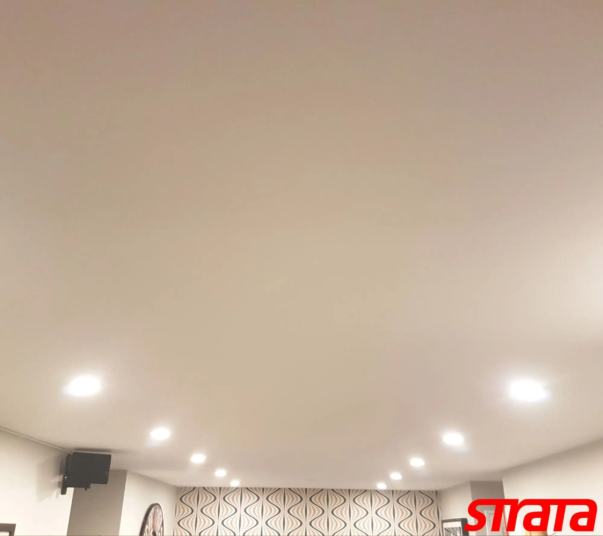 Dust-free popcorn ceiling removal in a downtown Toronto condo with smooth ceiling finishing and pot light upgrades.