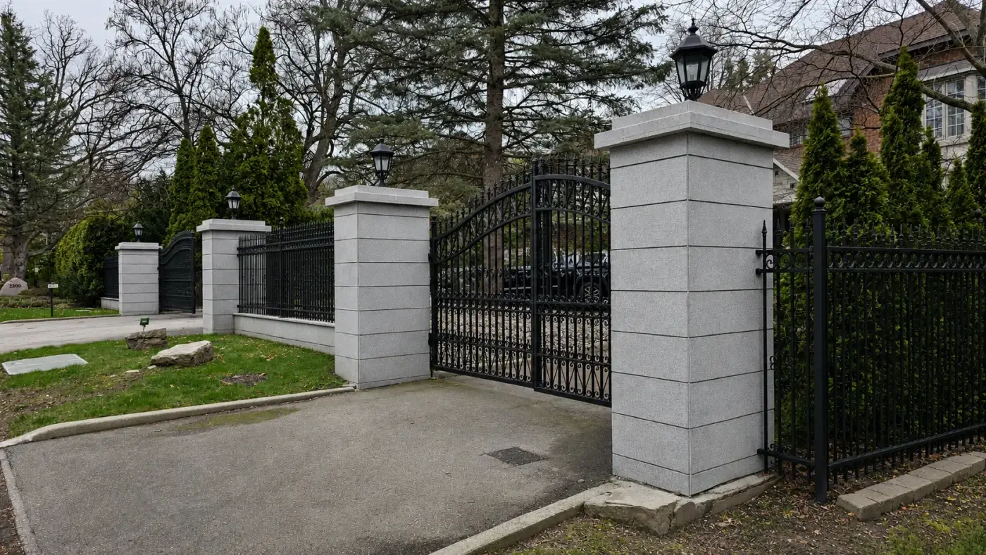 Toronto exterior gate and fence painting with a clean black finish on outdoor metal.