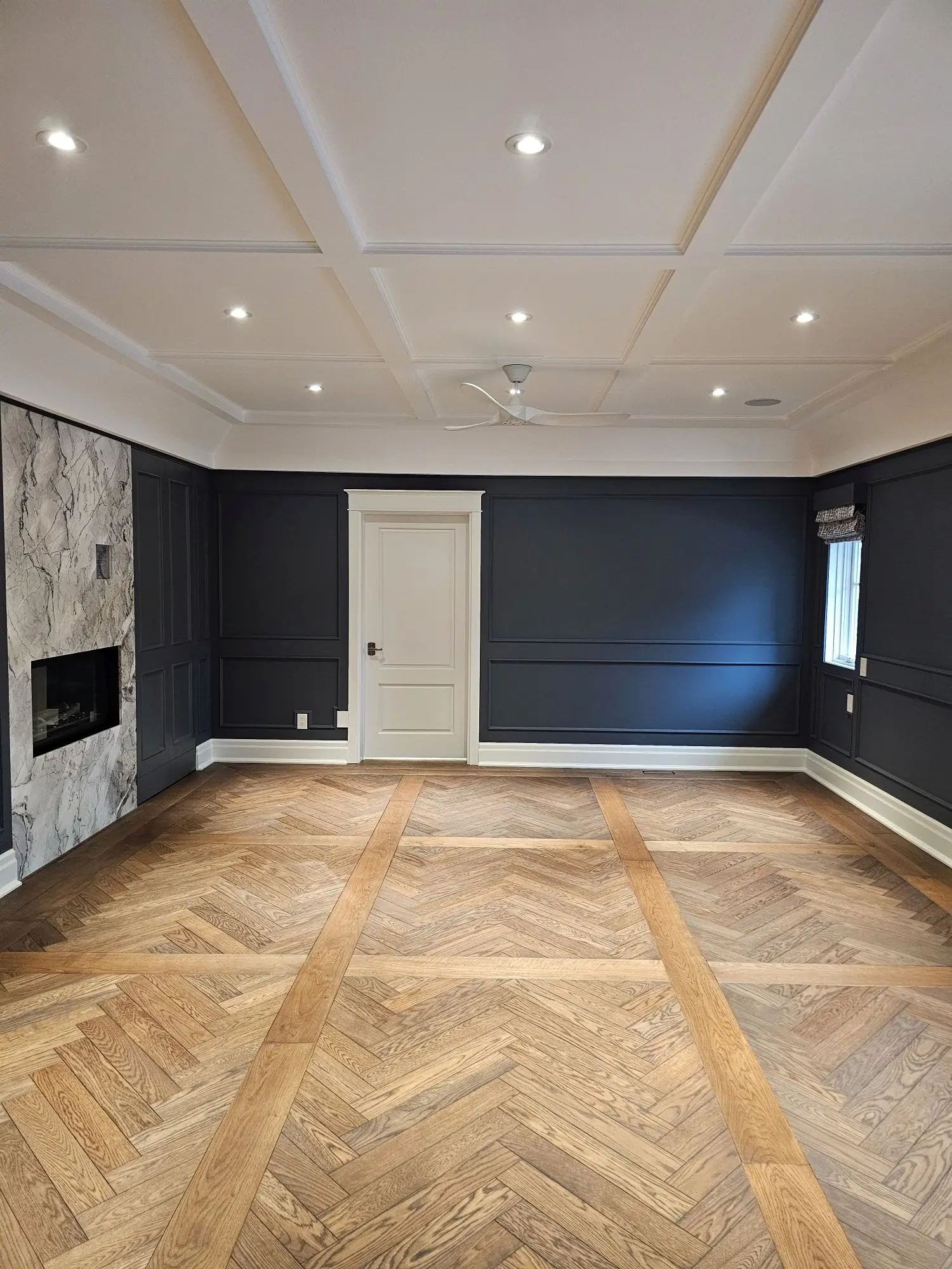 Herringbone hardwood floor installation in Toronto.