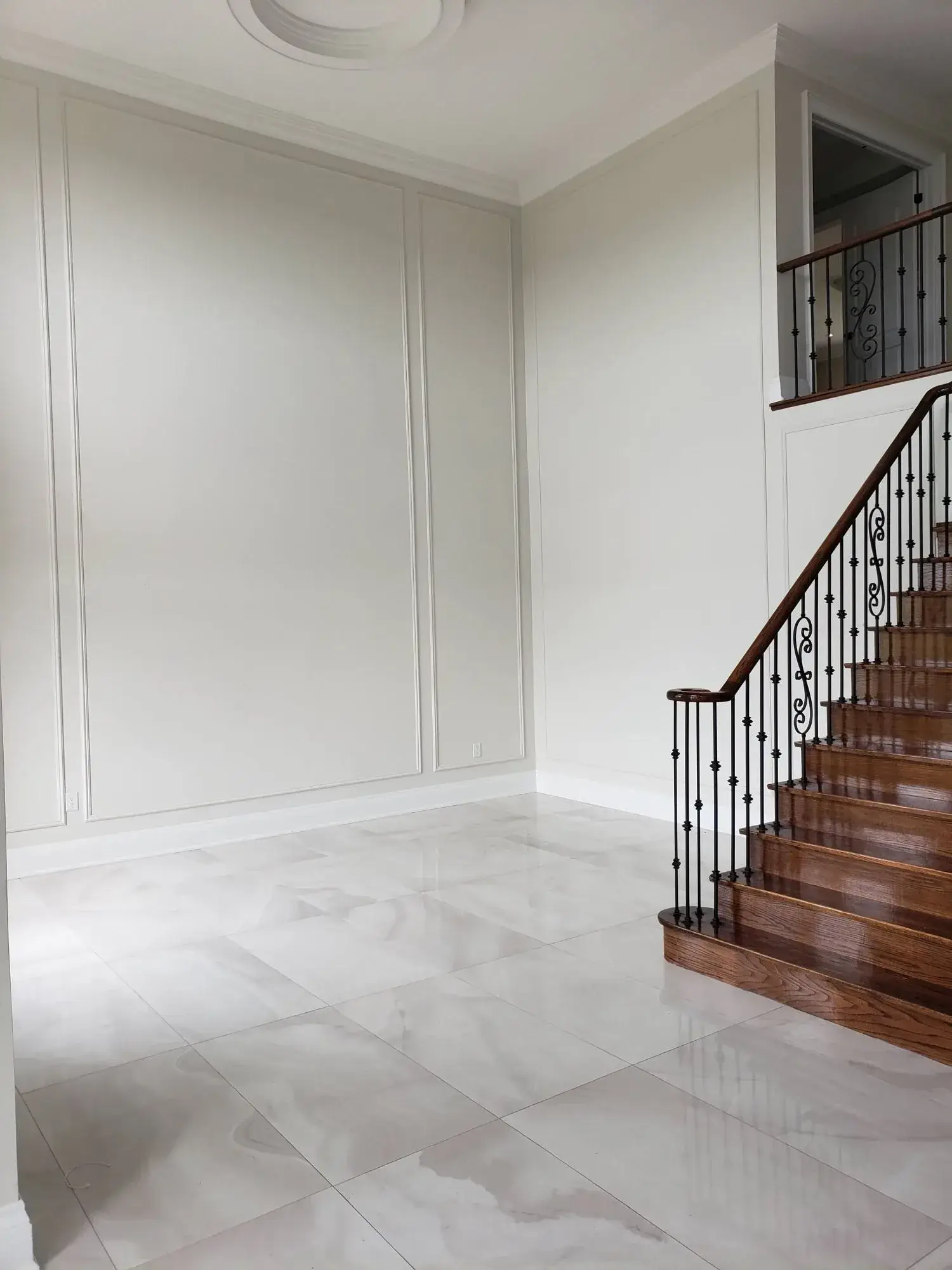Level 5 drywall finish and skim coating walls before smooth interior painting.