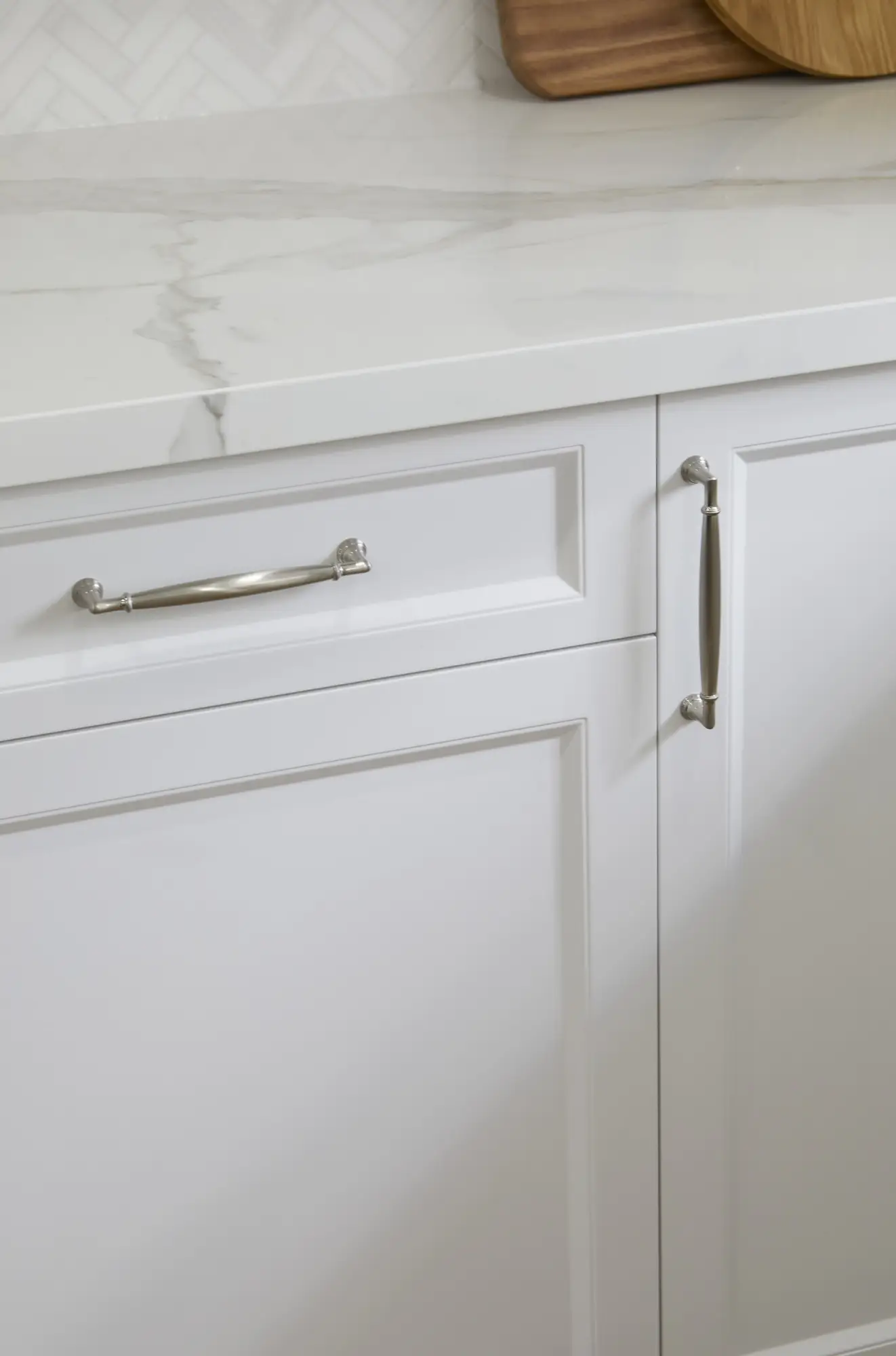 A warm wood-accent kitchen with stone backsplash and integrated lighting.