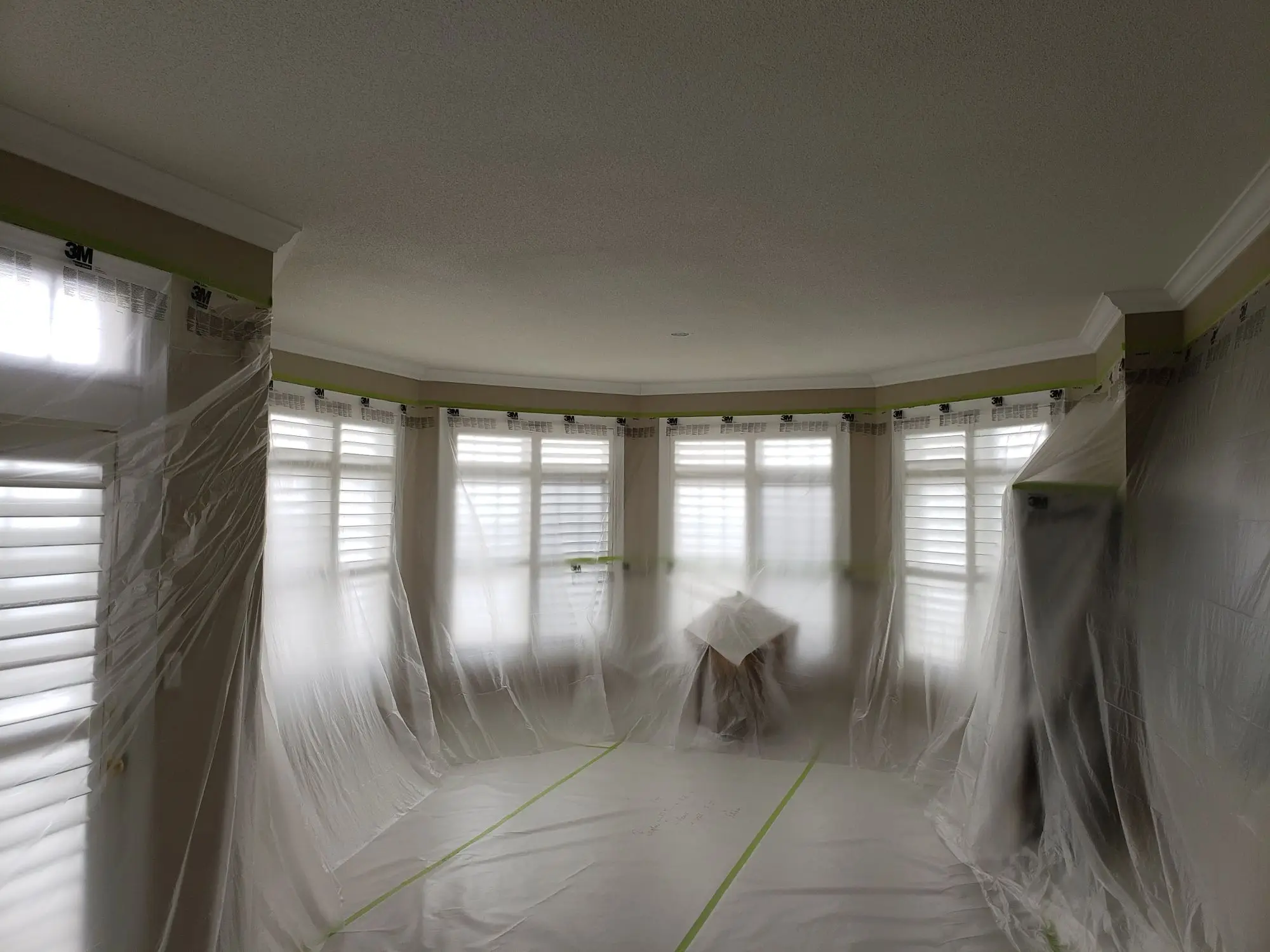Festool Planex dust-free popcorn ceiling removal in progress with complete surface protection and HEPA dust extraction.