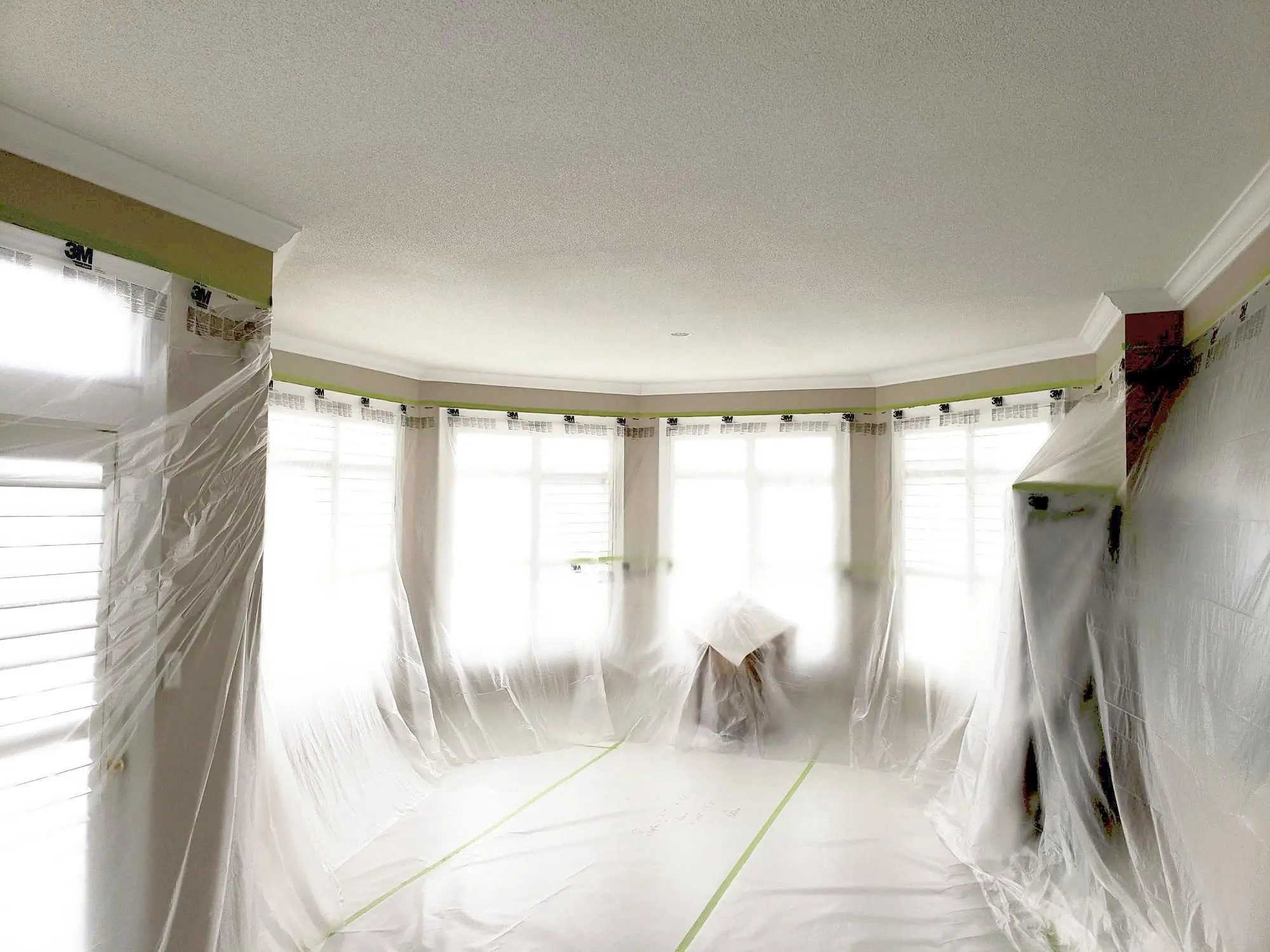 Festool Planex dust-free popcorn ceiling removal in progress with complete surface protection and HEPA dust extraction.