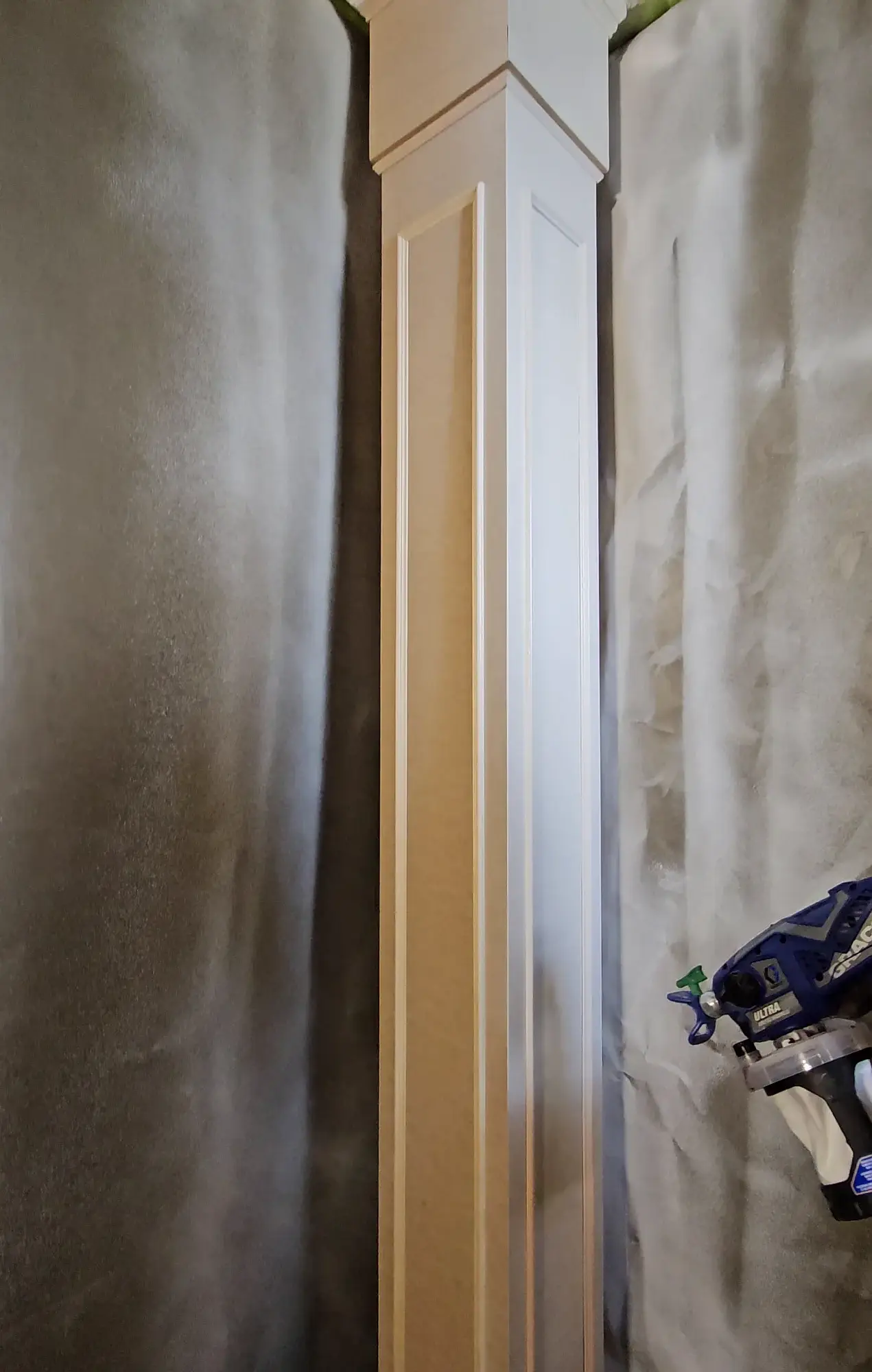 Trim and millwork painting with a smooth sprayed finish.