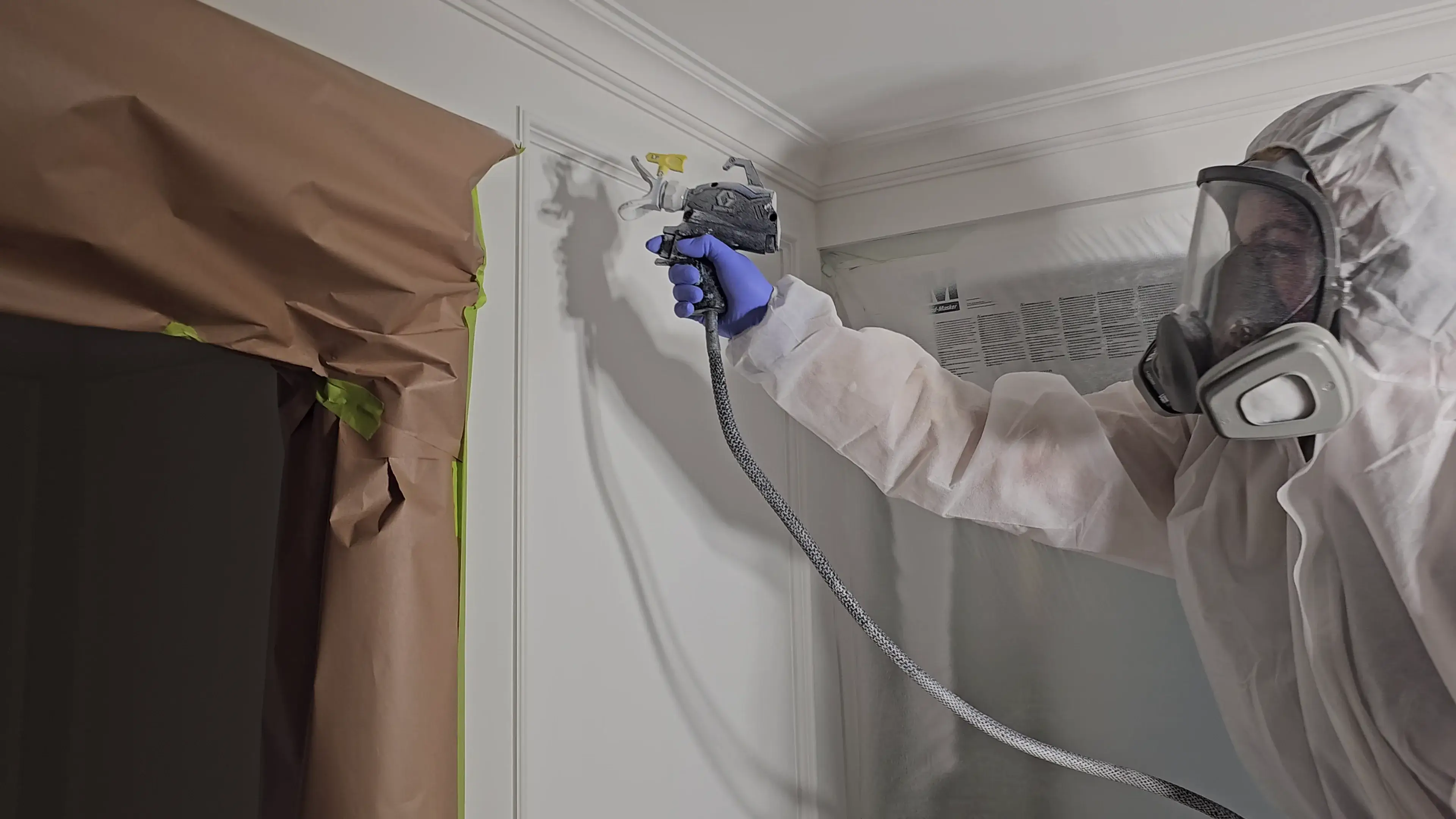 Wainscoting and trim painting with a smooth sprayed satin finish.