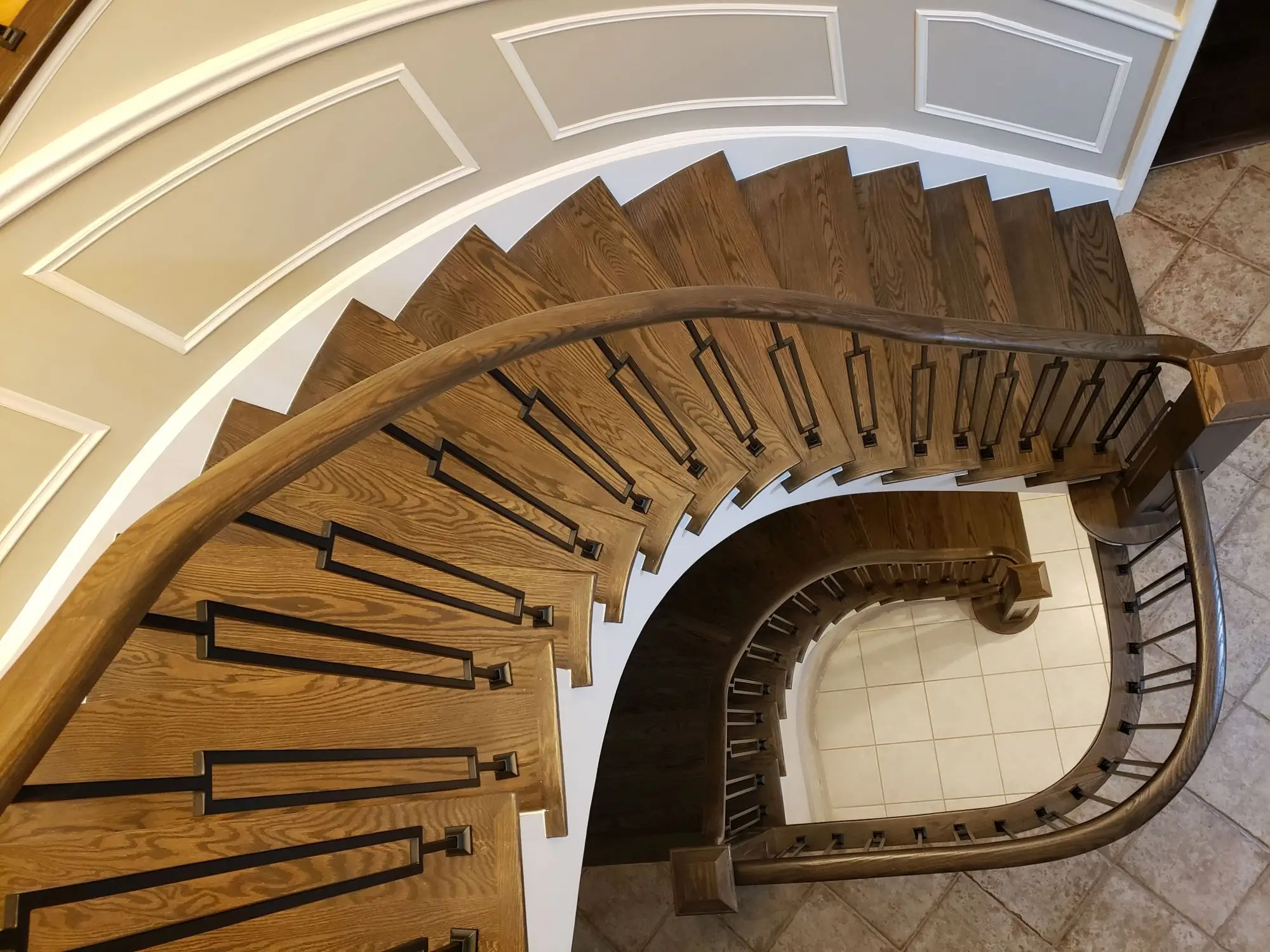 Curved stair railing installation in Mississauga.