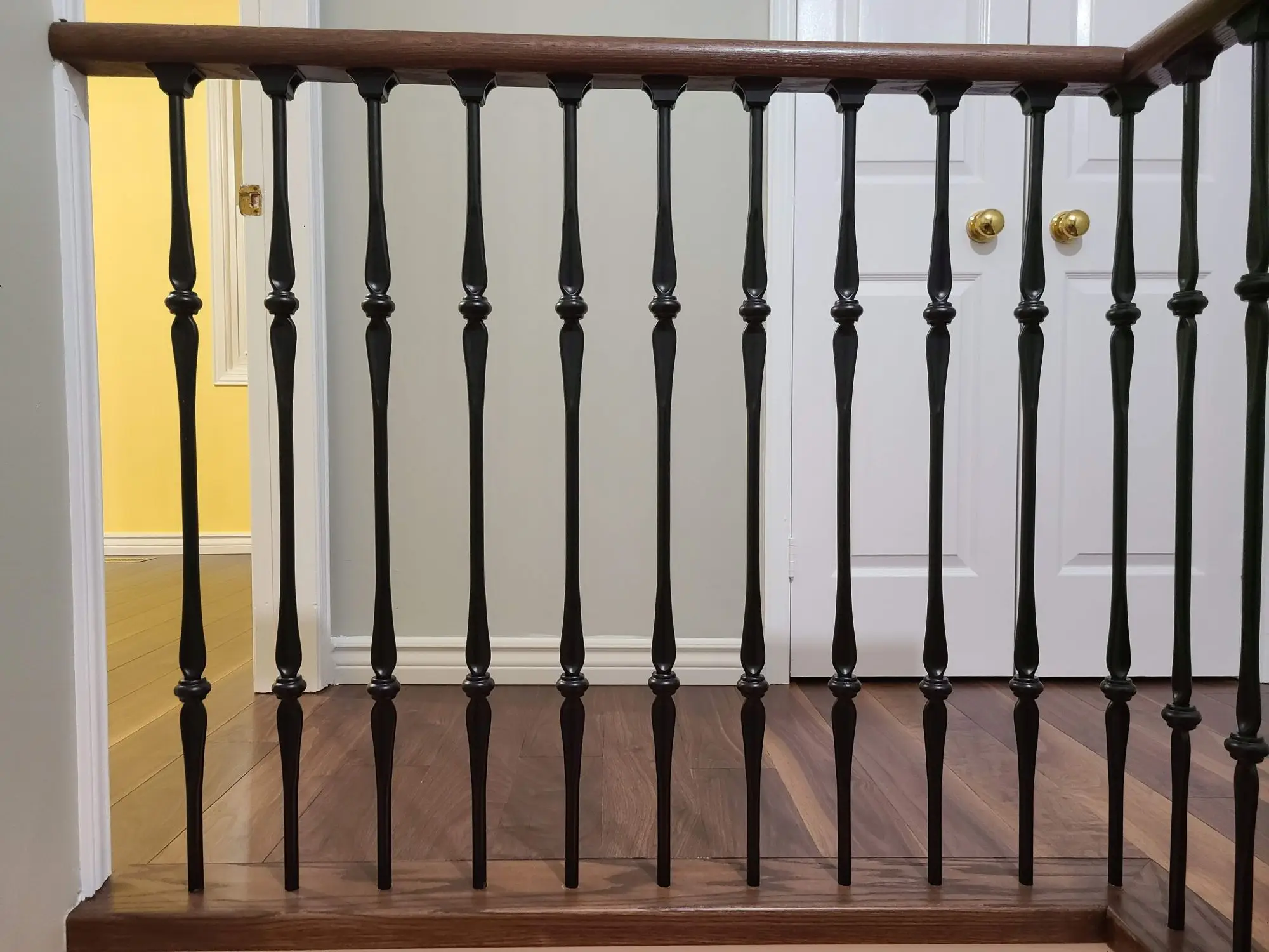 Matching upper landing railing installation in Toronto.