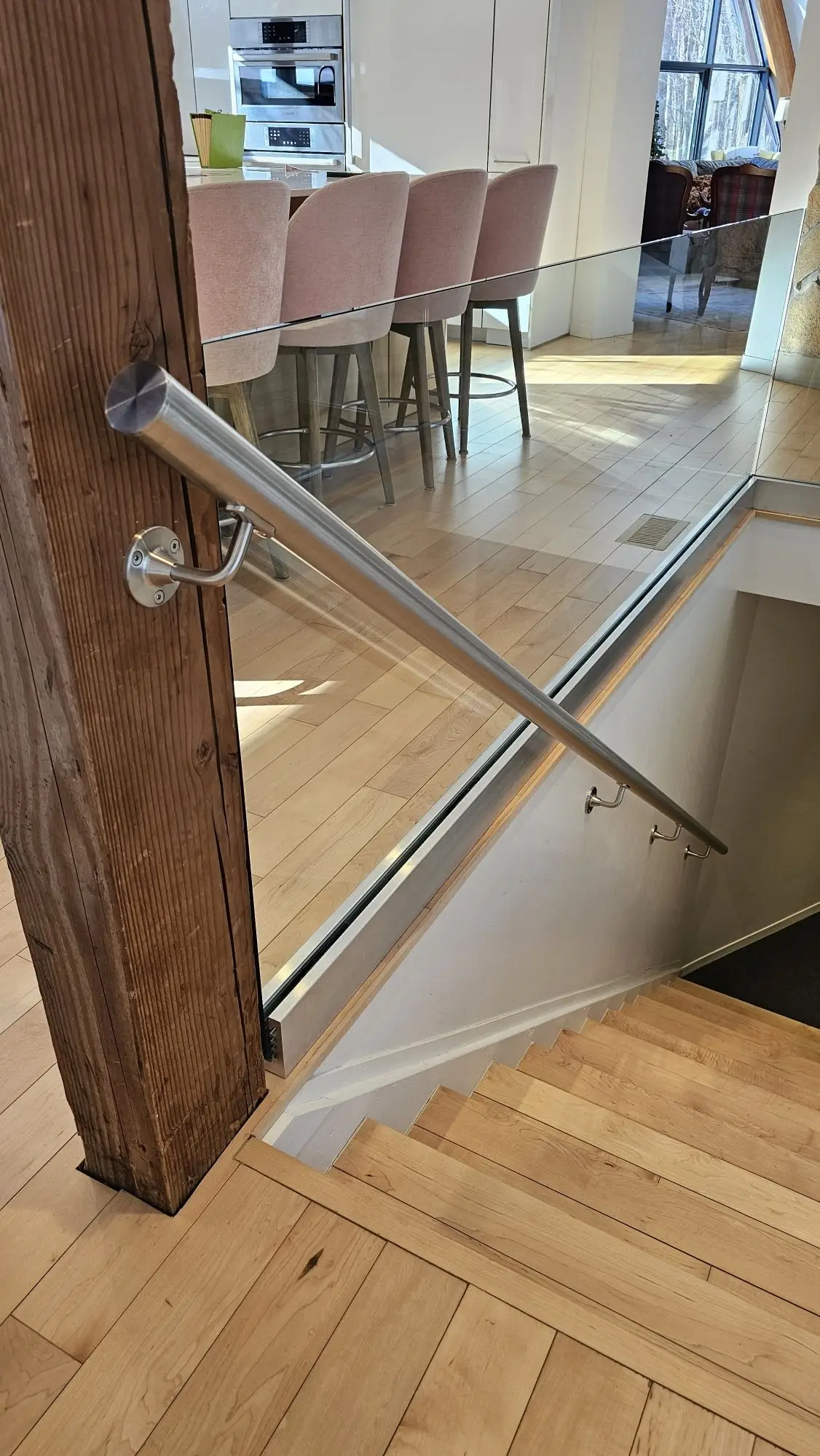 Stair railing installation in Vaughan with black balusters.