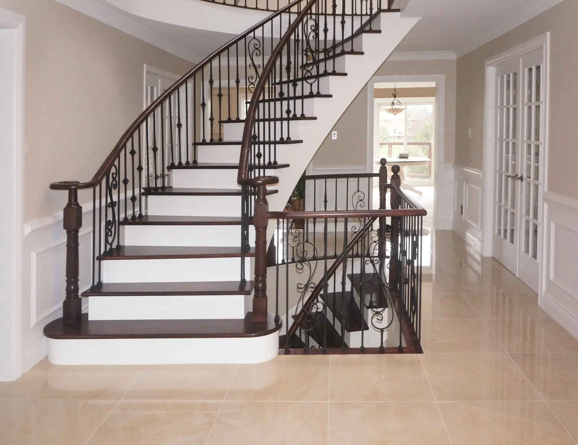 Hardwood stair tread cap installation in Toronto with oak and modern finish.