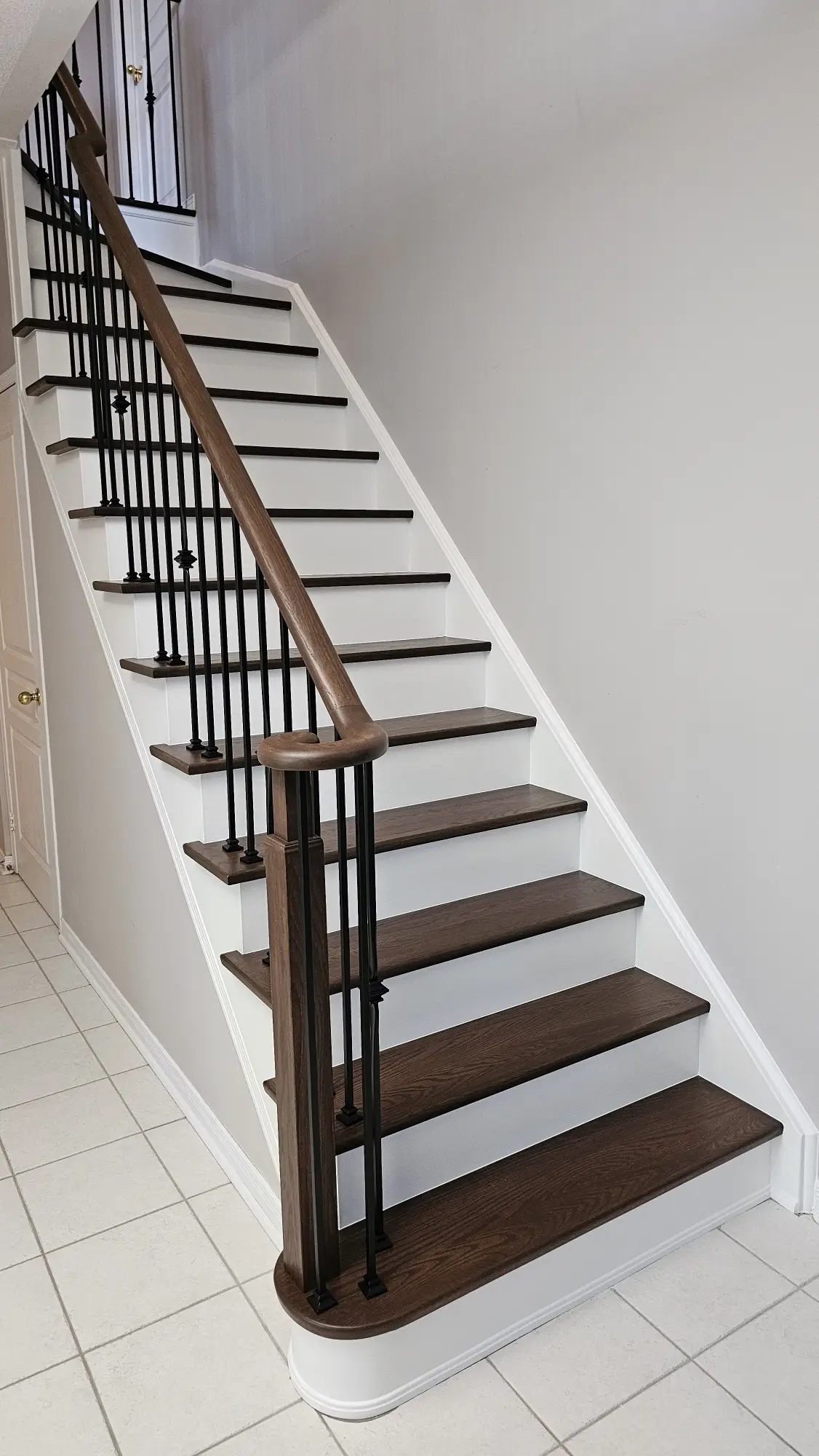 Classic dark wood staircase refinishing in Woodbridge.