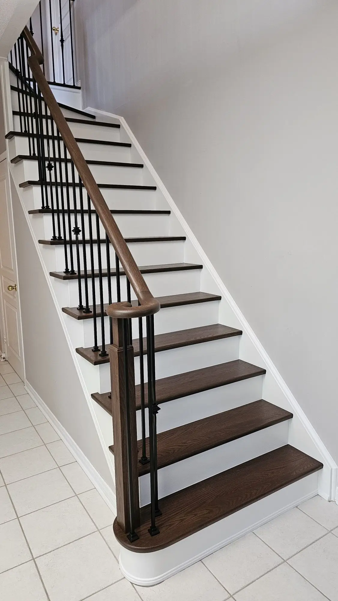 Classic dark wood staircase refinishing in Woodbridge.