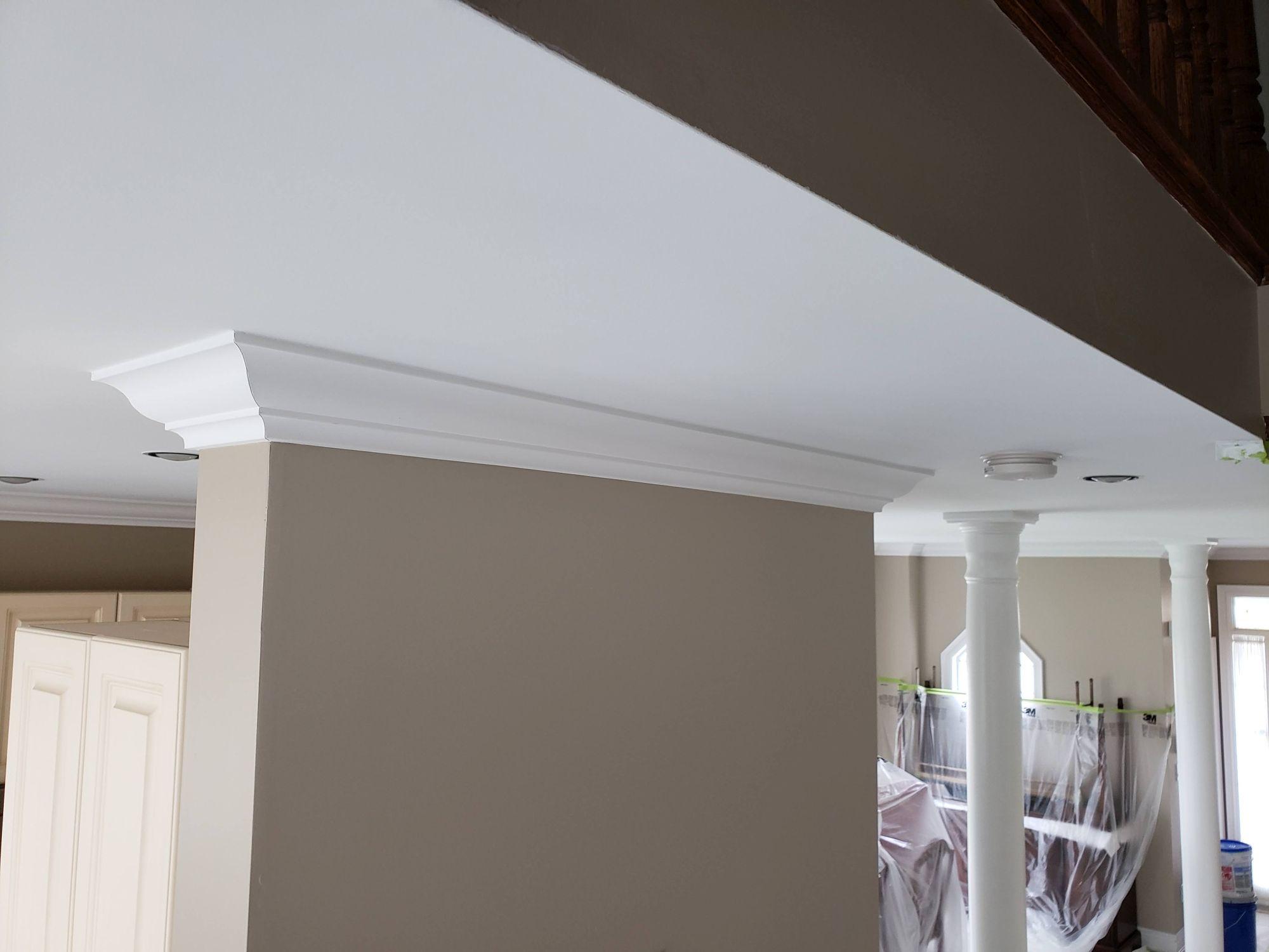 Perfectly smooth finished ceiling after the primary popcorn ceiling removal project shown on the Strataline service page.