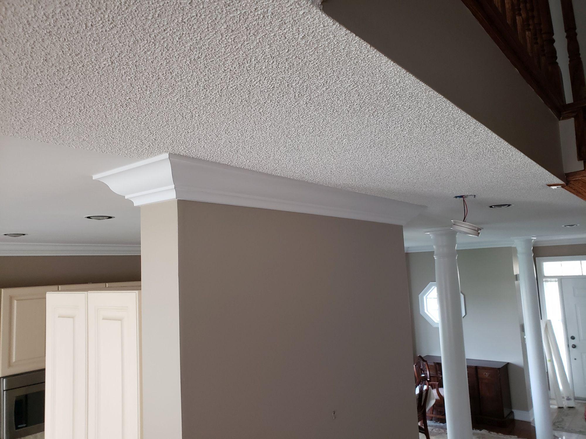 Textured ceiling before the primary popcorn ceiling removal project shown on the Strataline service page.