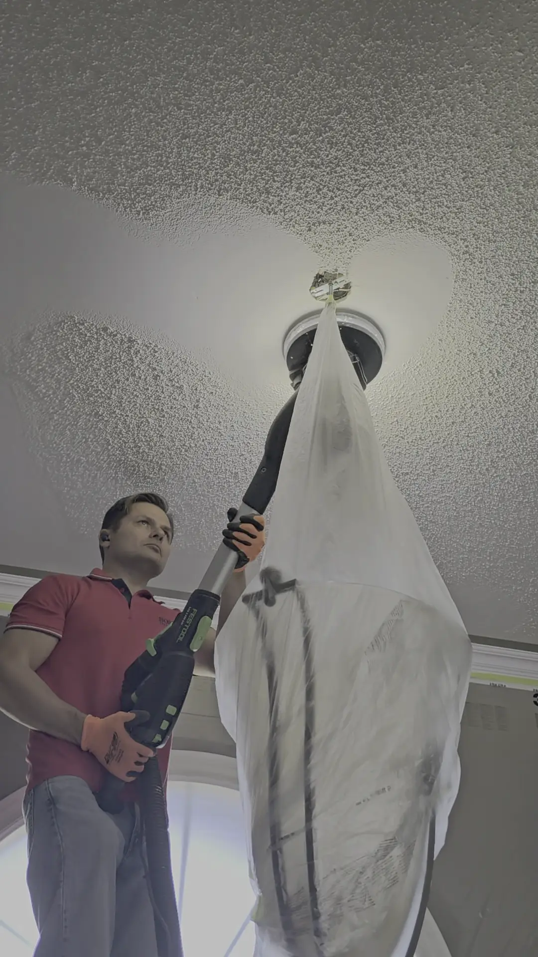 Popcorn ceiling removal and smoothing in a high-end Toronto home.