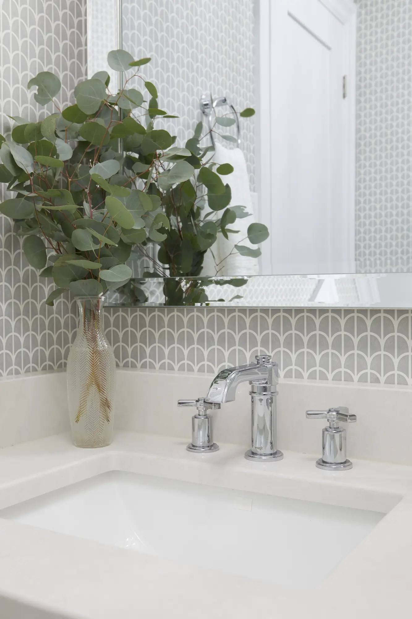 Grey textured wallpaper installed in a modern bedroom.