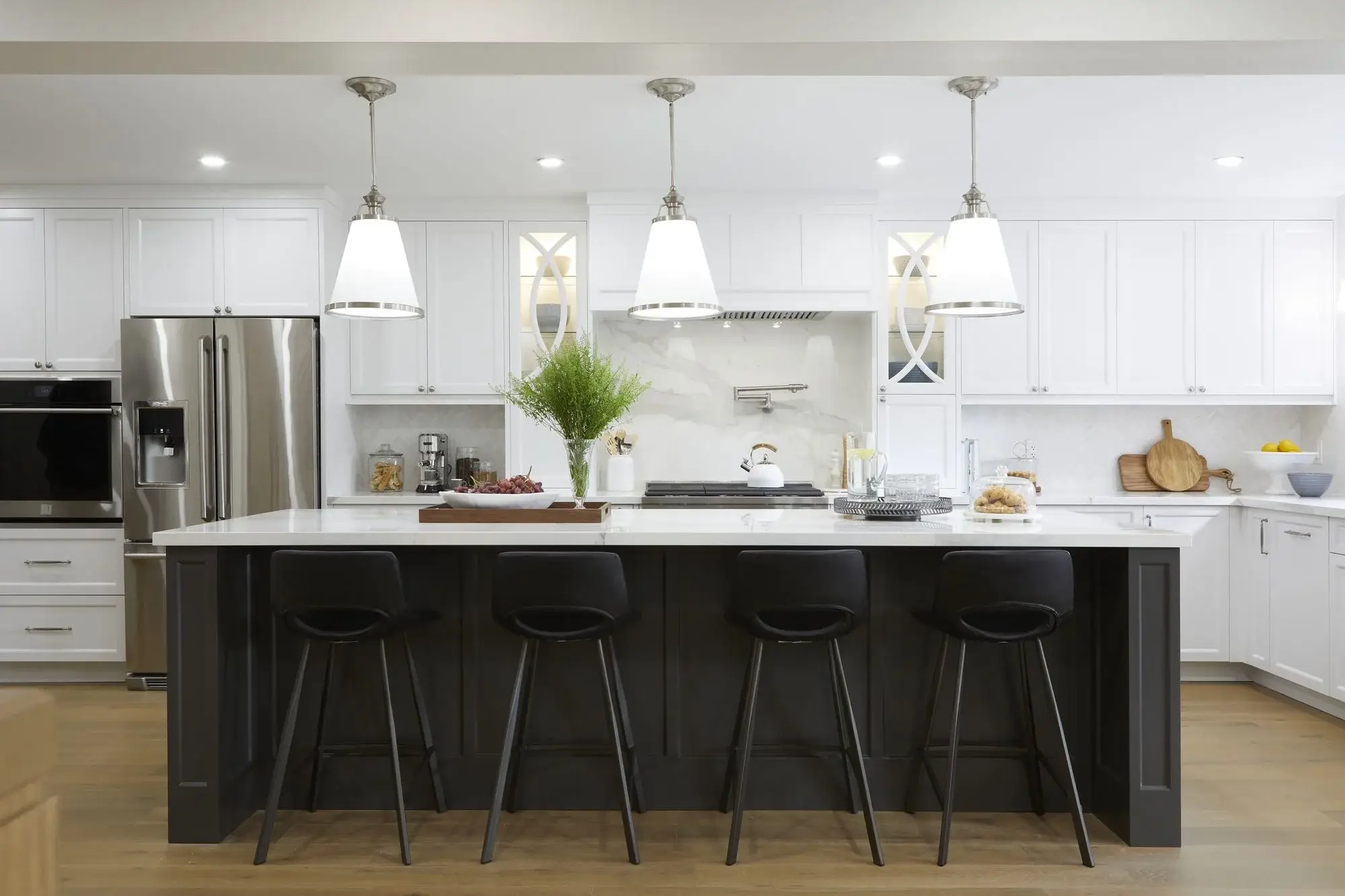 Kitchen island seating with quartz countertop, bright cabinetry, and family-friendly kitchen layout in Aurora.