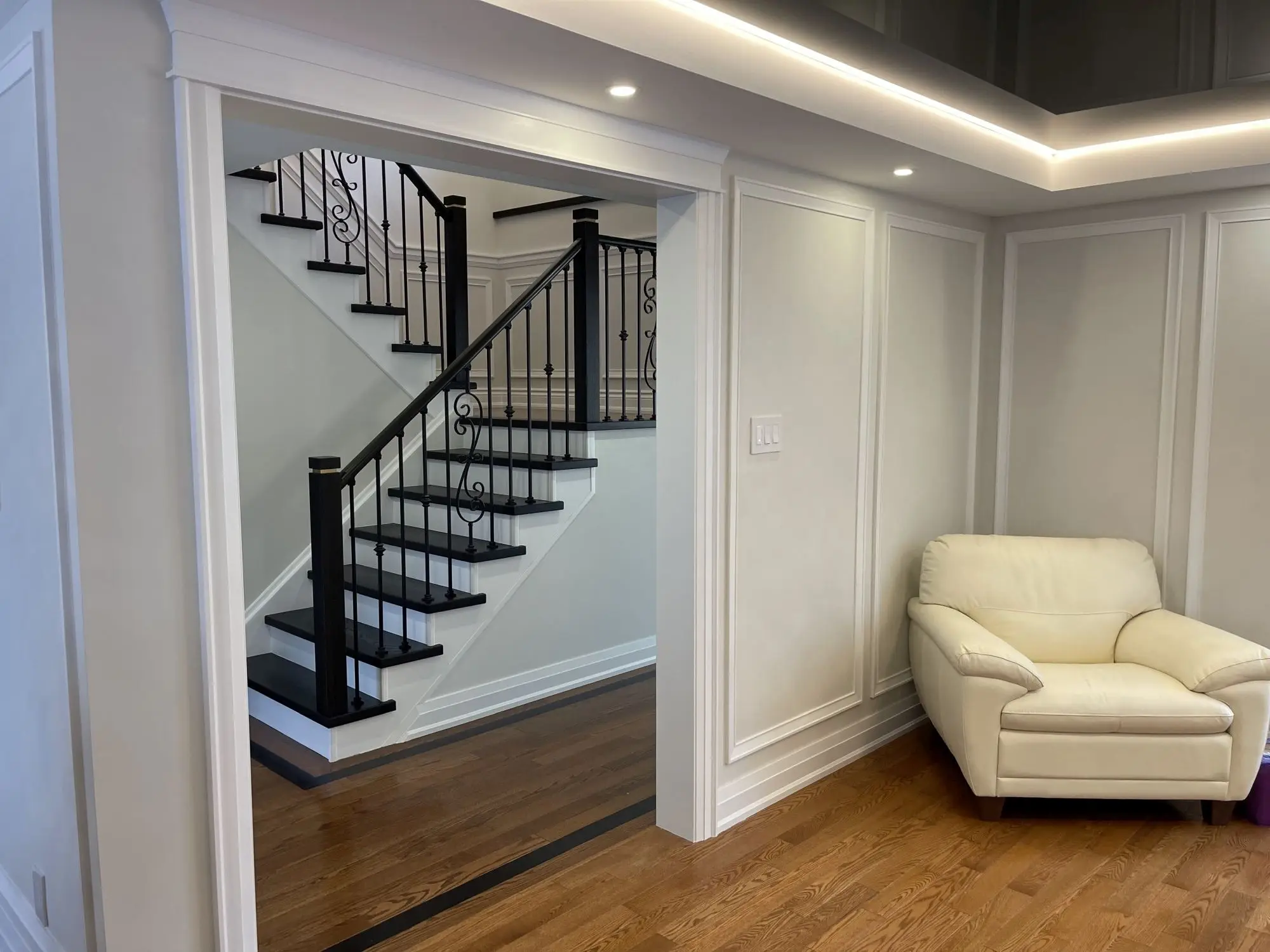 Staircase refinishing in Toronto open concept foyer.
