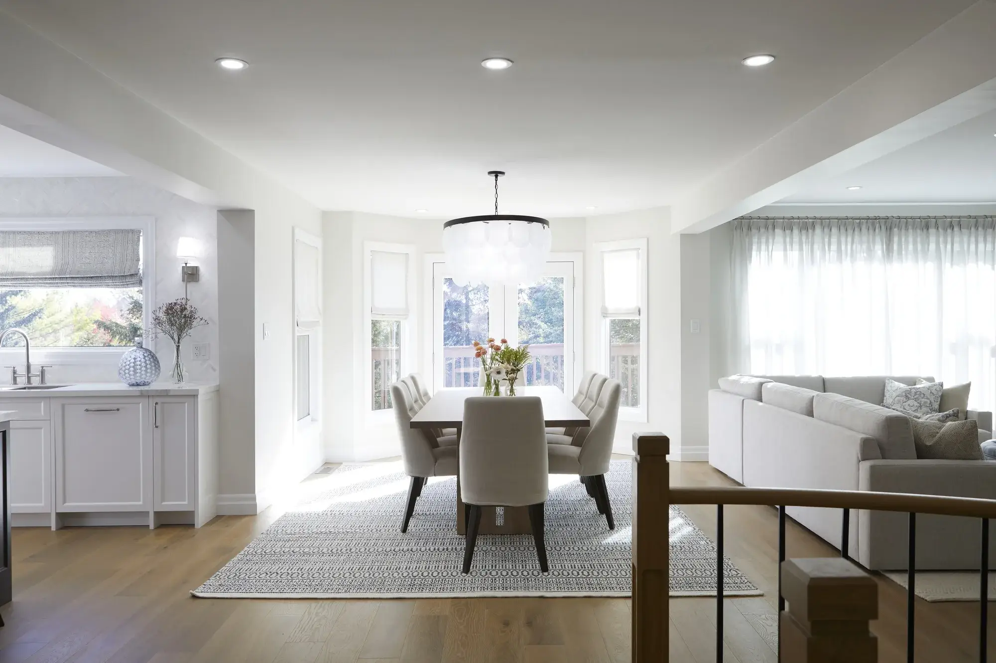 Toronto interior painting with bright dining room walls, clean trim, and a finished open living space.