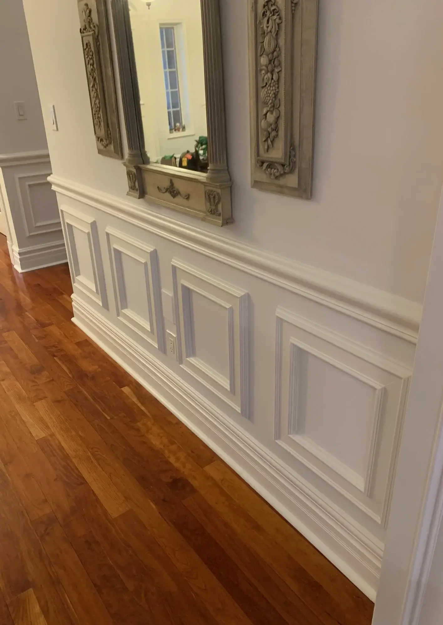 Wainscoting, doors, trim, and baseboard painting with a sprayed satin finish.