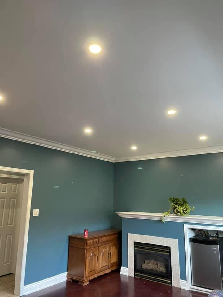 Completed smooth ceiling and recessed pot lights across the open main floor.