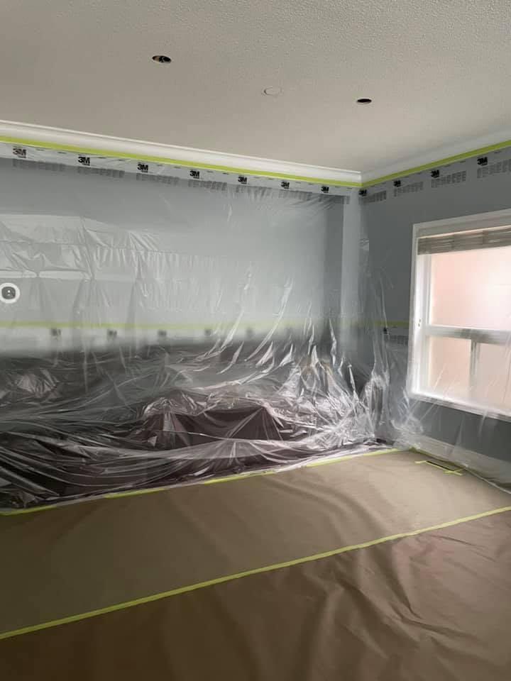 Room protected for popcorn ceiling removal and new pot-light electrical openings.