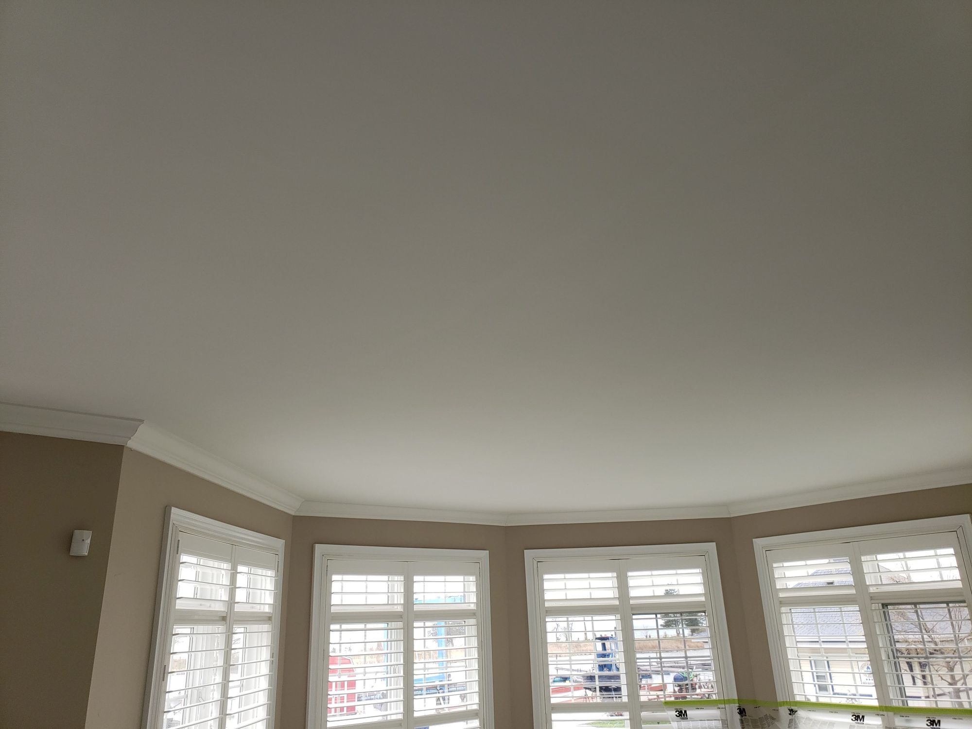 Popcorn ceiling removal around natural light after