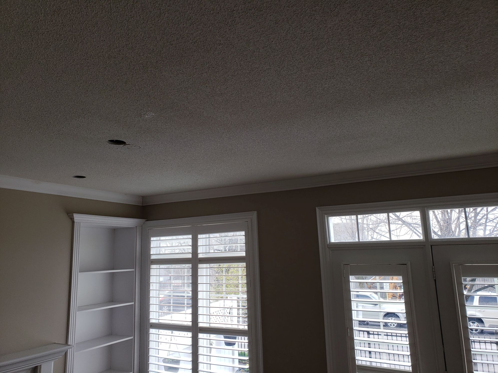 Room-wide popcorn ceiling transformation before